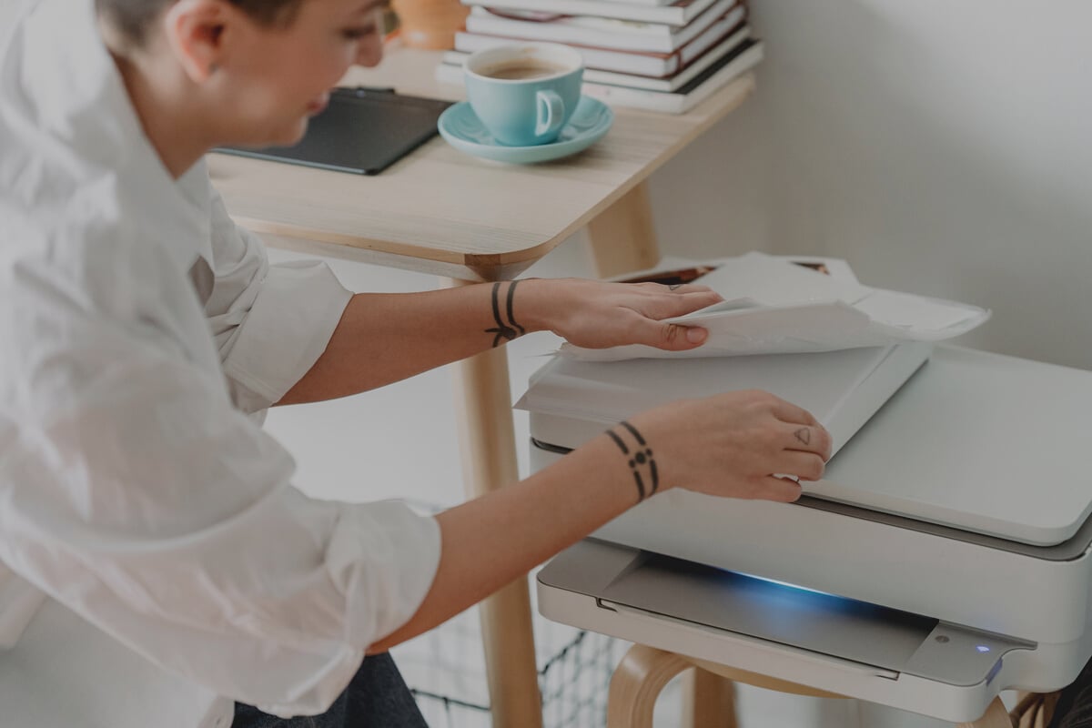 Woman preparing paper for printing photos