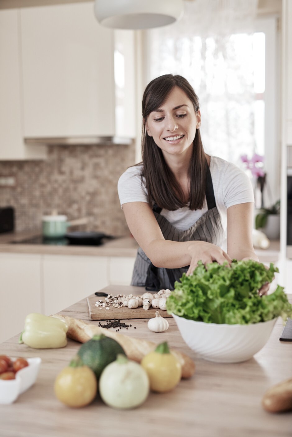 Woman cooking dinner.